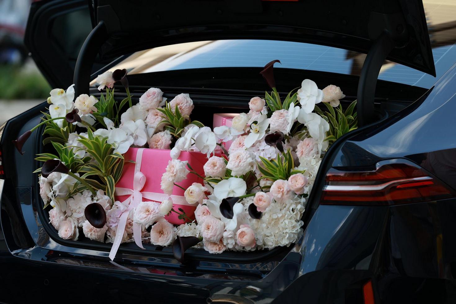 Elegant floral gift boxes mid-reveal